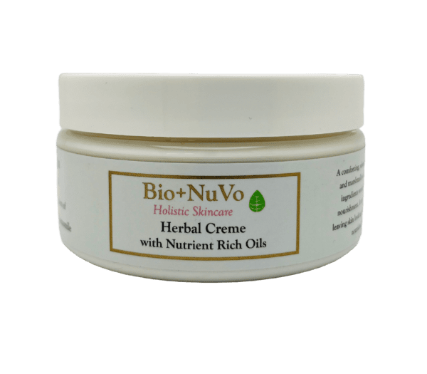 A jar of herbal creme with nutrient rich oils.