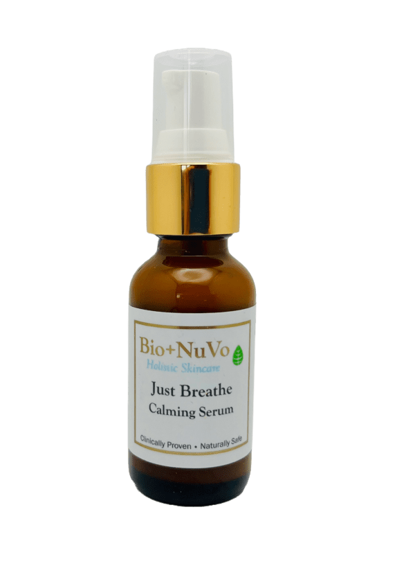 A bottle of just breathe calming serum on a green background.